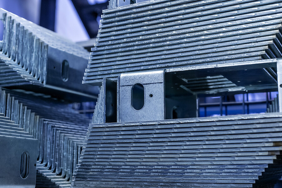Stacked sheet metal parts for smoke barrier and fire curtain housings